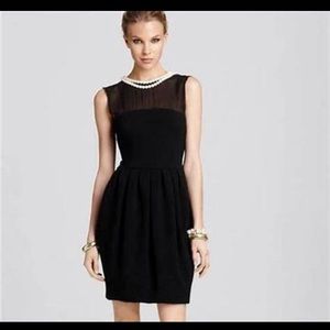 Perfect little black dress with its own pearls!